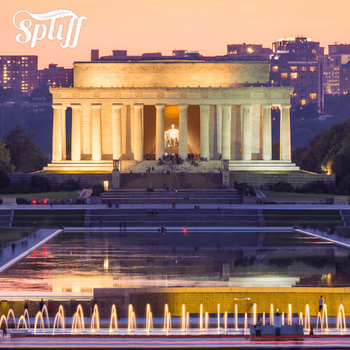 Lincoln Memorial at sunset in New York City, NY, with illuminated fountain in foreground.